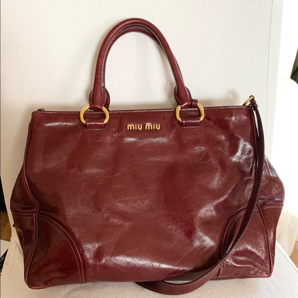 Miu Miu bag in wine red.